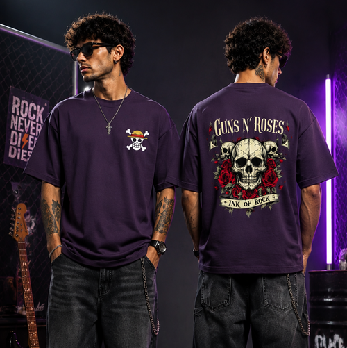 Two models wearing a dark purple Guns N' Roses t-shirt, showing both the front and back views in a dark, atmospheric studio setting with purple lighting.