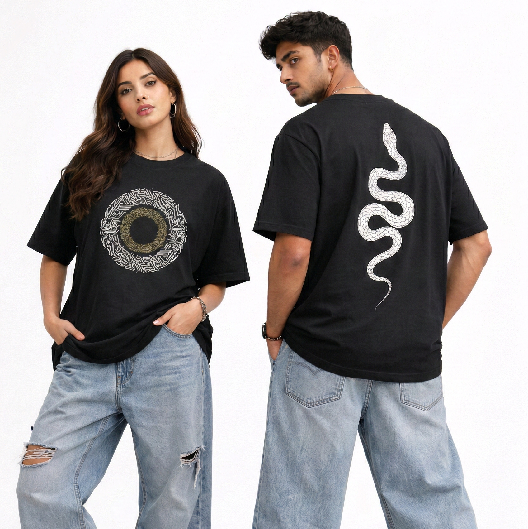 Two people wearing black t-shirts with graphic designs, standing side by side on a light background.